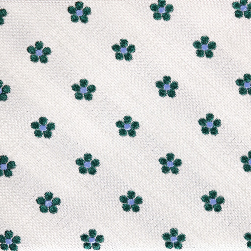 Fiori verde scuro su garza bianco