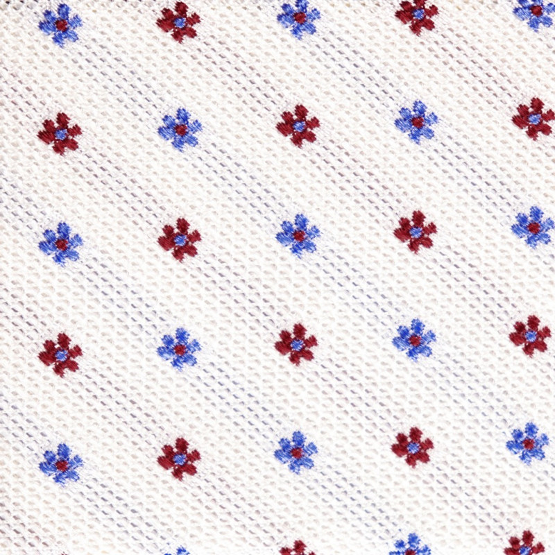 Fiori celesti e rossi su garza bianco Fiori celesti e rossi su garza bianco